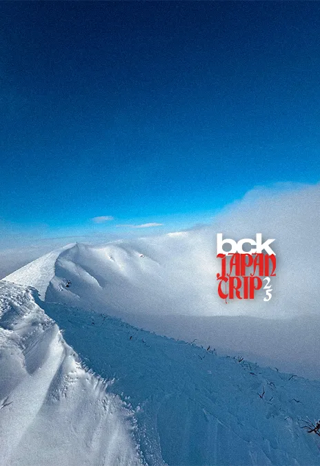 Snowy mountain ridge with the BCK Japan Trip logo